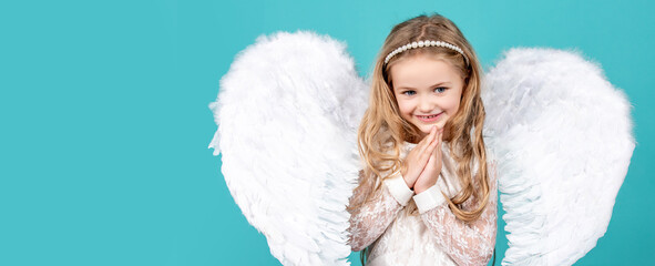 Angel child banner, isolated studio background. Beautiful little angel girl standing with your arms...