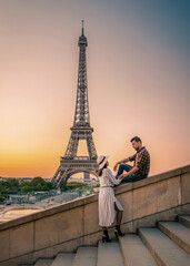 couple men and woman honeymoon on Paris Eiffel tower France, couple men and woman city trip in...