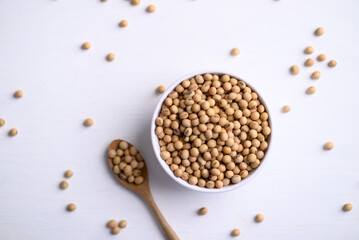 Soybean seeds in bowl with spoon, food ingredients high protein good for vegetarian and vegan