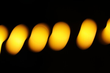 Golden bokeh background, glare of light in the form of circles