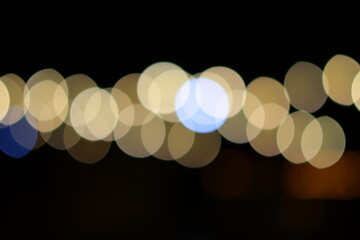 Golden bokeh background, glare of light in the form of circles