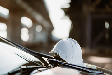 The hard plastic helmet of an engineer placed on the elevated construction site around the city.