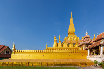 Fototapeta na wymiar Pha That Luang is gold large Buddhist stupa and the most important national monument in Laos and national symbol, Vientiane, Laos.