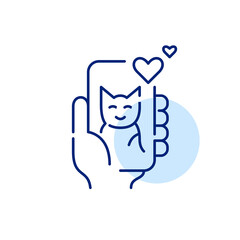 Hand holding smartphone with cat picture and likes. Pixel perfect, editable stroke line icon