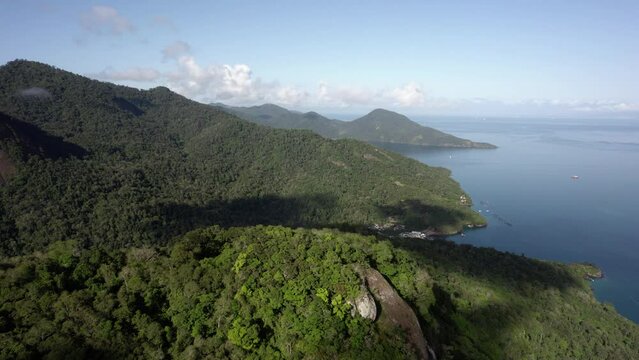 Aerial view the forest and the mountainous coast of Ilha Grande, in sunny Brazil