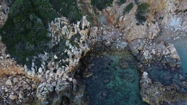 Stunning aerial of paradisiac secluded bay with turquoise water, Sardinia