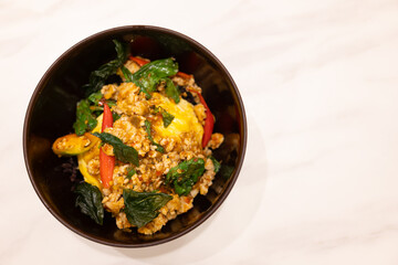 Stir Fried Basil with Minced Pork and Scrambled Egg on Rice. Thai food.