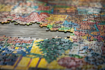 A puzzle on a table partially done