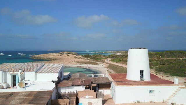 Spanish finca on mountain on the beach.
Calm aerial view flight overflight flyover drone footage
formentera ibiza beach spain, day 2022. 4k marnitz Cinematic