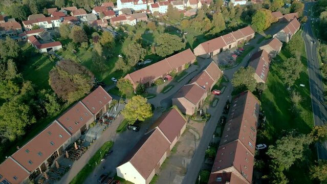 historical Barn district in the city Kremmen in Brandenburg.
Beautiful aerial view flight panorama overview drone, golden houre 2022. 4k marnitz Cinematic