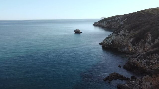 Stunning aerial of secluded bay in South Sardinia, Maladroxia beach, dolly in
