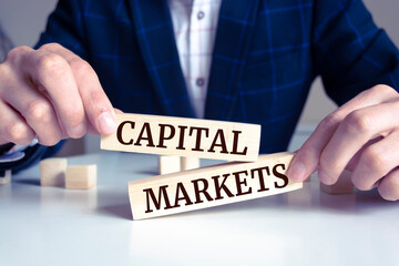 Obraz premium Wooden blocks with words 'CAPITAL MARKETS'. Business concept