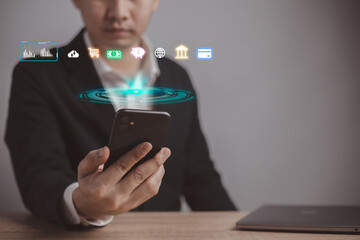 Cryptocurrency fintech theme with businessman using a smartphone