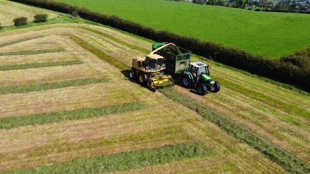 Aerial view of a New Holland FX68 Self Propelled Harvester a Deutz Fahr Tractor with a NC Trailer contracting Grass for Silage 01-01-23
