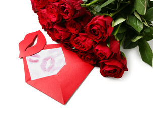 Red roses, envelope with lipstick kisses and paper lips on white background. Valentine's Day celebration