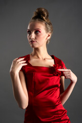 Young beautiful blond woman in red dress