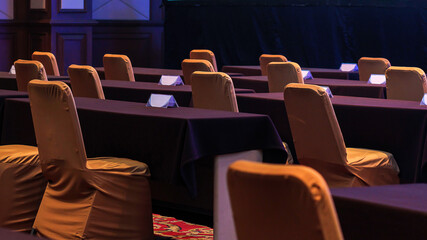 Table and chairs in the auditorium.