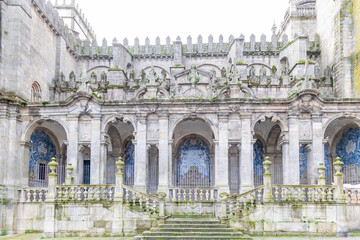 Fototapeta premium Porto, Portugal - December 07, 2022: details of the Porto Cathedral facade and the square in front of the main entrance, with tourists taking pictures in Porto, Portugal