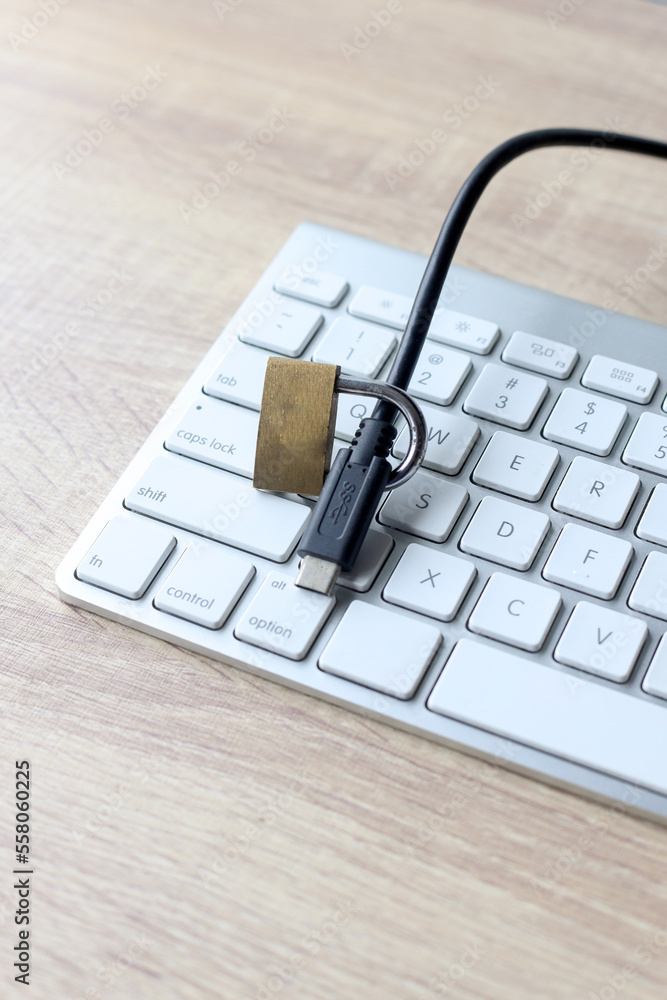 Poster lock cable on the computer keyboard on the desk