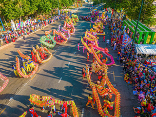 Top view of dragon dance perform celebration new year. Group of people perform a traditional lion...