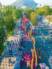 Top view of dragon dance perform celebration new year. Group of people perform a traditional lion...