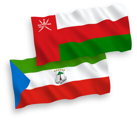 National vector fabric wave flags of Sultanate of Oman and Republic of Equatorial Guinea isolated on white background. 1 to 2 proportion.
