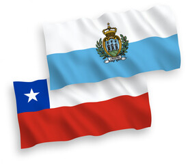 National vector fabric wave flags of San Marino and Chile isolated on white background. 1 to 2 proportion.