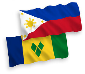 National vector fabric wave flags of Saint Vincent and the Grenadines and Philippines isolated on white background. 1 to 2 proportion.