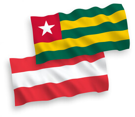 National vector fabric wave flags of Austria and Togolese Republic isolated on white background. 1 to 2 proportion.