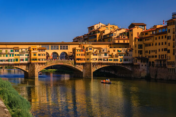 Fototapeta na wymiar Close up of silversmith shops on the famous Ponte Vecchio bridge on the Arno River in Centro Storico, Florence, Italy