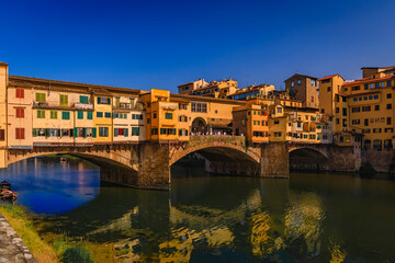 Fototapeta na wymiar Close up of silversmith shops on the famous Ponte Vecchio bridge on the Arno River in Centro Storico, Florence, Italy