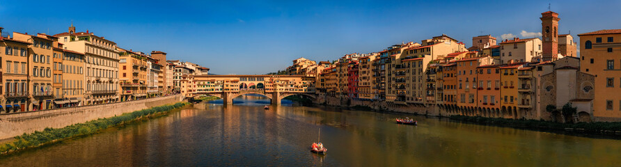 Cityscape with the famous bridge of Ponte Vecchio on the river Arno River in Centro Storico, Florence, Italy