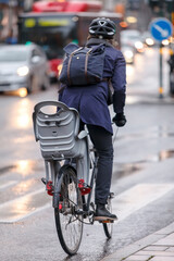 Scandinavian hip woman or man on bike.