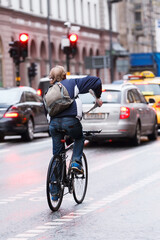 Fototapeta premium Scandinavian hip woman or man on bike.