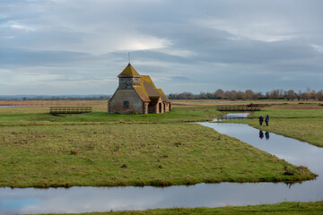 Three ladies photographing the Thomas a Becket Church