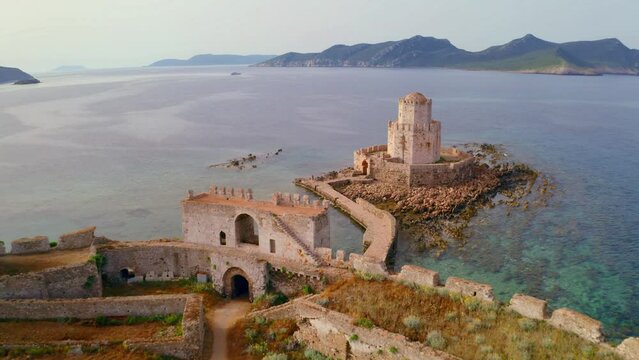 4k drone flight back footage (Ultra High Definition) of old Methoni Castle. Aerial seascape of Ionian sea. Beautiful outdoor scene of Peloponnese peninsula, Greece, Europe.
