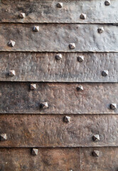 Old metal door with rivets. Close up