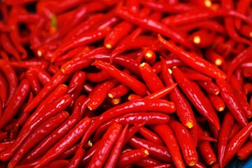 red chili peppers piled up in the market