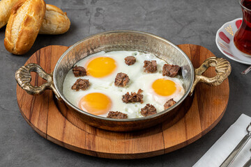 Turkish scrambled eggs Turkish name Kavurmali Yumurta with roasted meat in copper pan