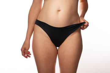 woman body abdomen wearing black soft lingerie, microfibre underwear, seamless brazilian briefs