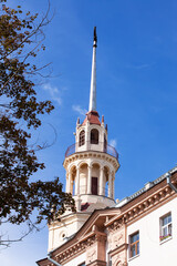 Tower on the old building and trees