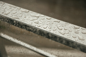 Raindrops on a French Balcony Metal Behind the Window