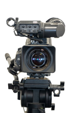 Old studio video camera on tripod, a front view, isolated on white background