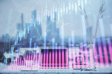 Forex Chart hologram on table with computer background. Double exposure. Concept of financial markets.