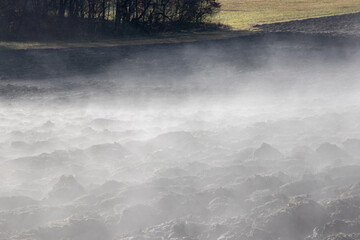 Steam evaporating from a plowed soil
