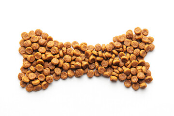 A bone shape consisting of dog food pellets on a white background.