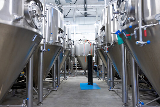 Interior of a brewery with big metal vats