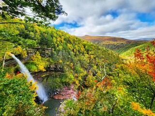 A scenic autumn view of Kaaterskill Falls in the Catskill Mountains of New York. 