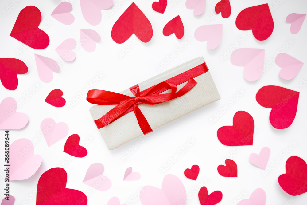 Wall mural valentine's day composition mockup with pink and red paper hearts and gifts with red ribbon isolated on white background. top view. copy space. flat lay. February 14 concept