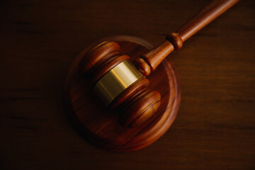 Business and lawyers discussing contract papers with brass scale on desk in office. Law, legal services, advice, justice and law concept picture with film grain effect